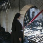 راهبة تتفقد مكان الحريق